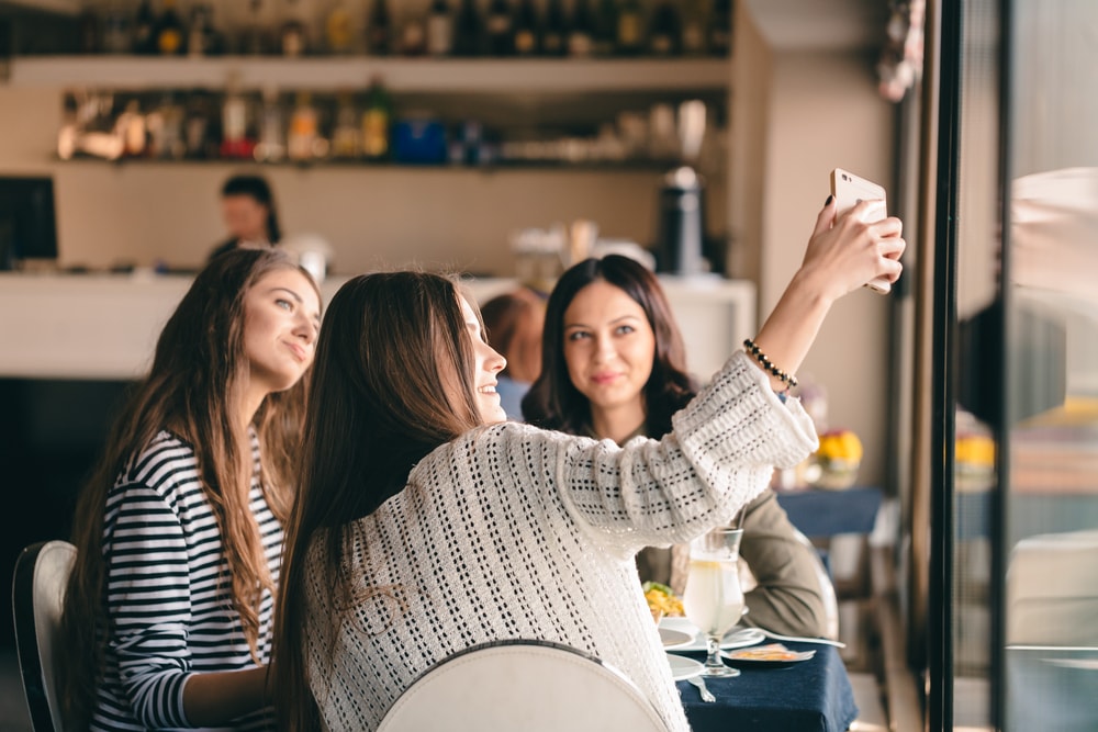 someone taking a selfie with their friends