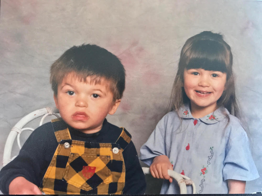 This is a family photo of Amy and Ross as children