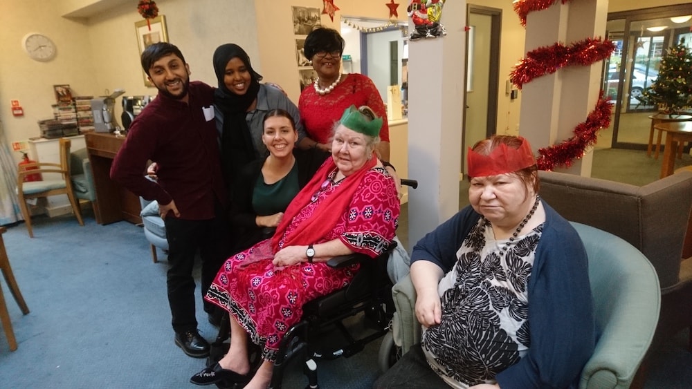 This is a photo of Mohammad with a few residents at Ester Randall Court at Christmas time