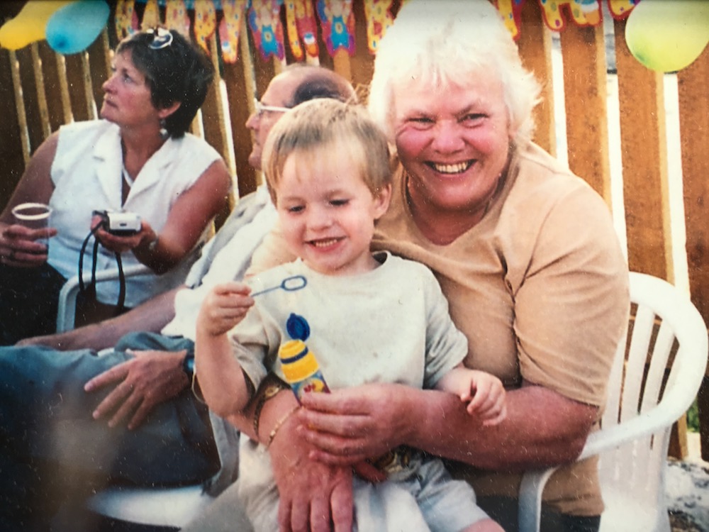 This is photo of Harry as a child, sat on his nan's lap