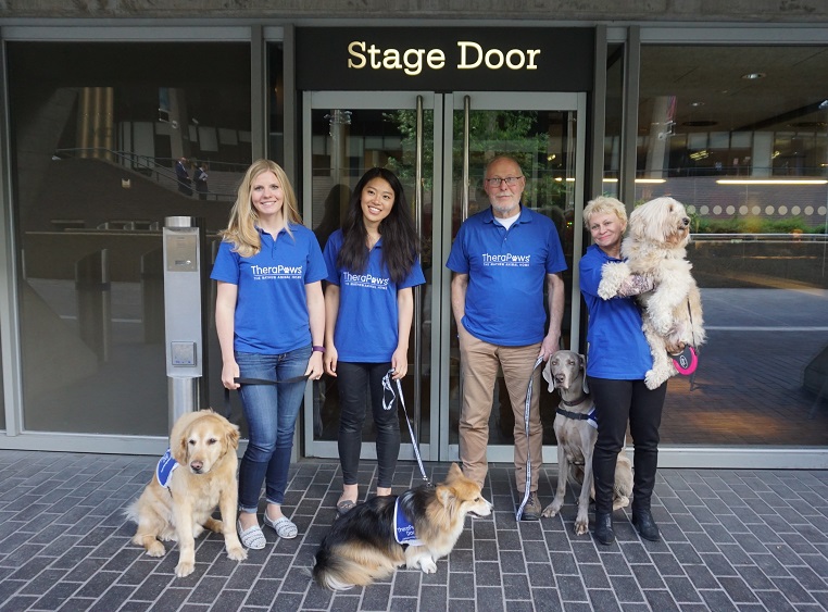 This is photo the TheraPaws humans and doggies team outside the 'Stage Door'.