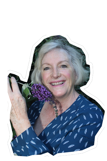 Yvonne, happiful reader in her garden with flowers