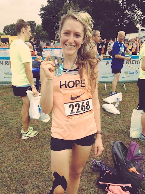 This is a photo of Hope with a medal for running