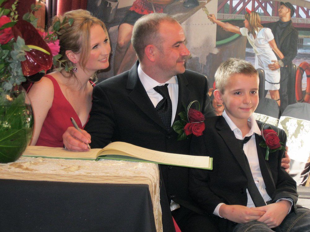Lucy with her husband, Chris, and her stepson, Sam, on her wedding day