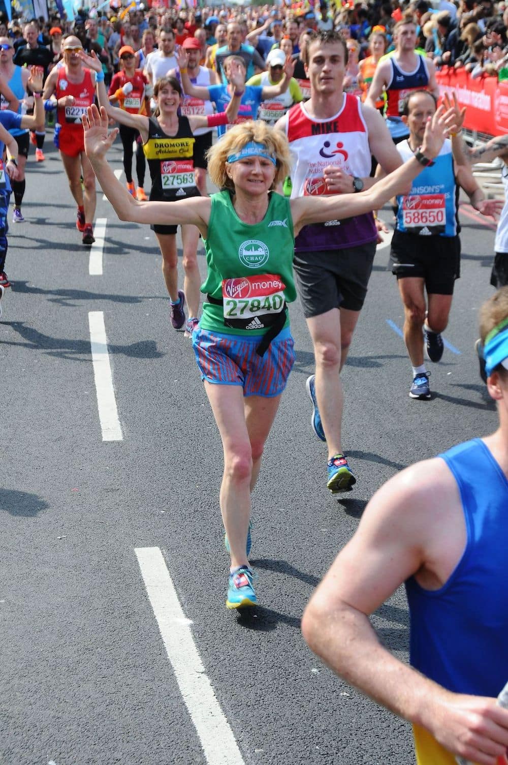 Jenny finishing the marathon and cheering