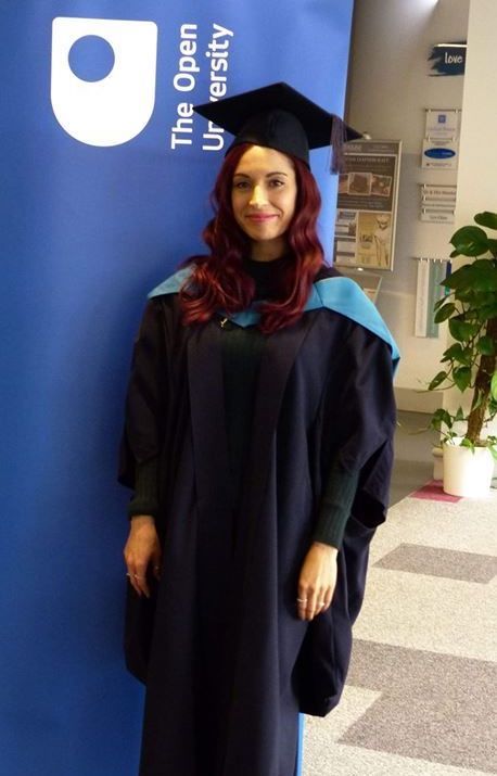 Vikki in her cap and gown at her graduation ceremony