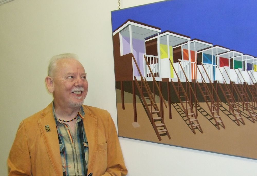 Brian looking at his artwork in a gallery