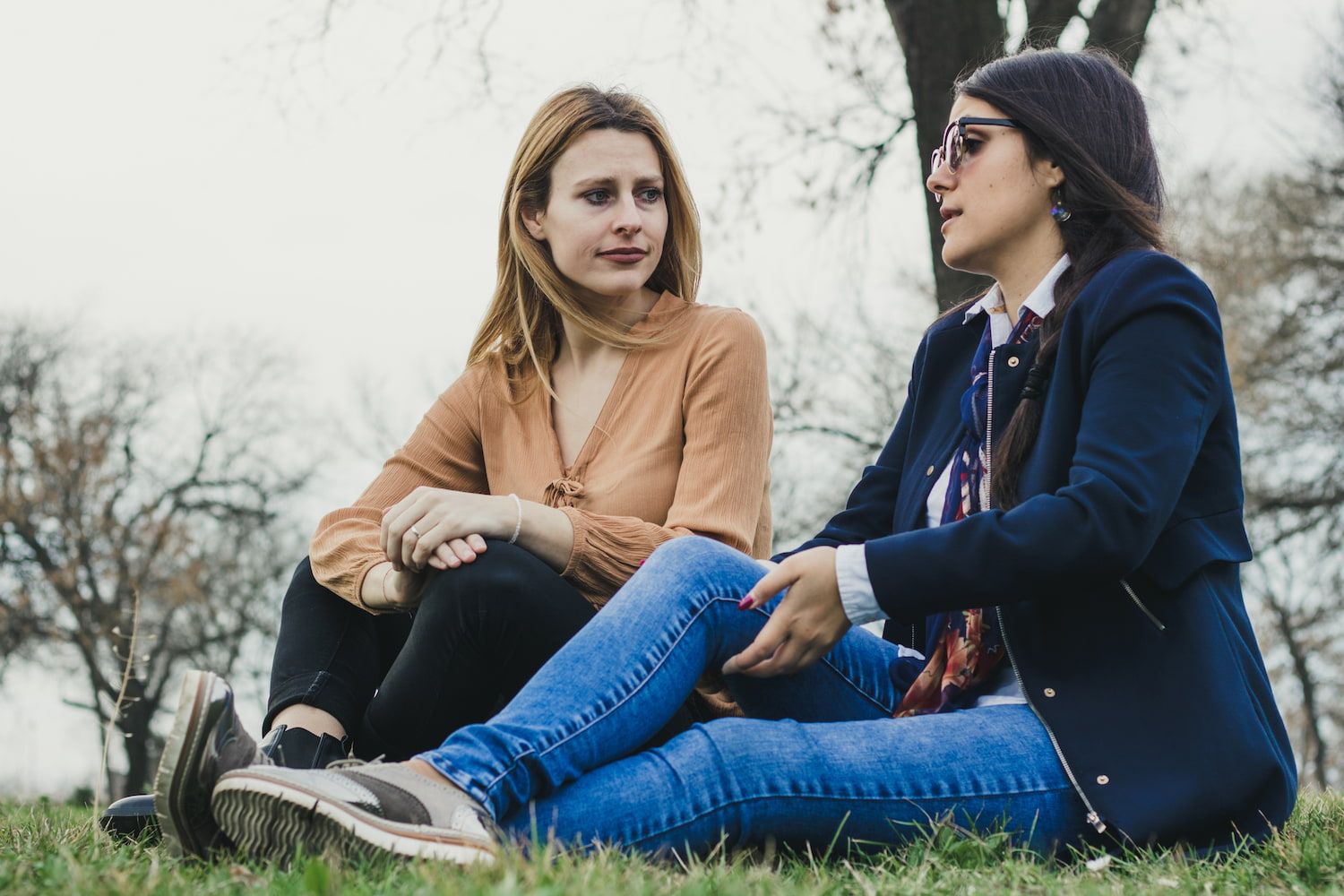 Two women talking in a park
