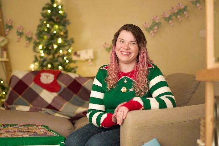 Photo of Lucy smiling at home during Christmas