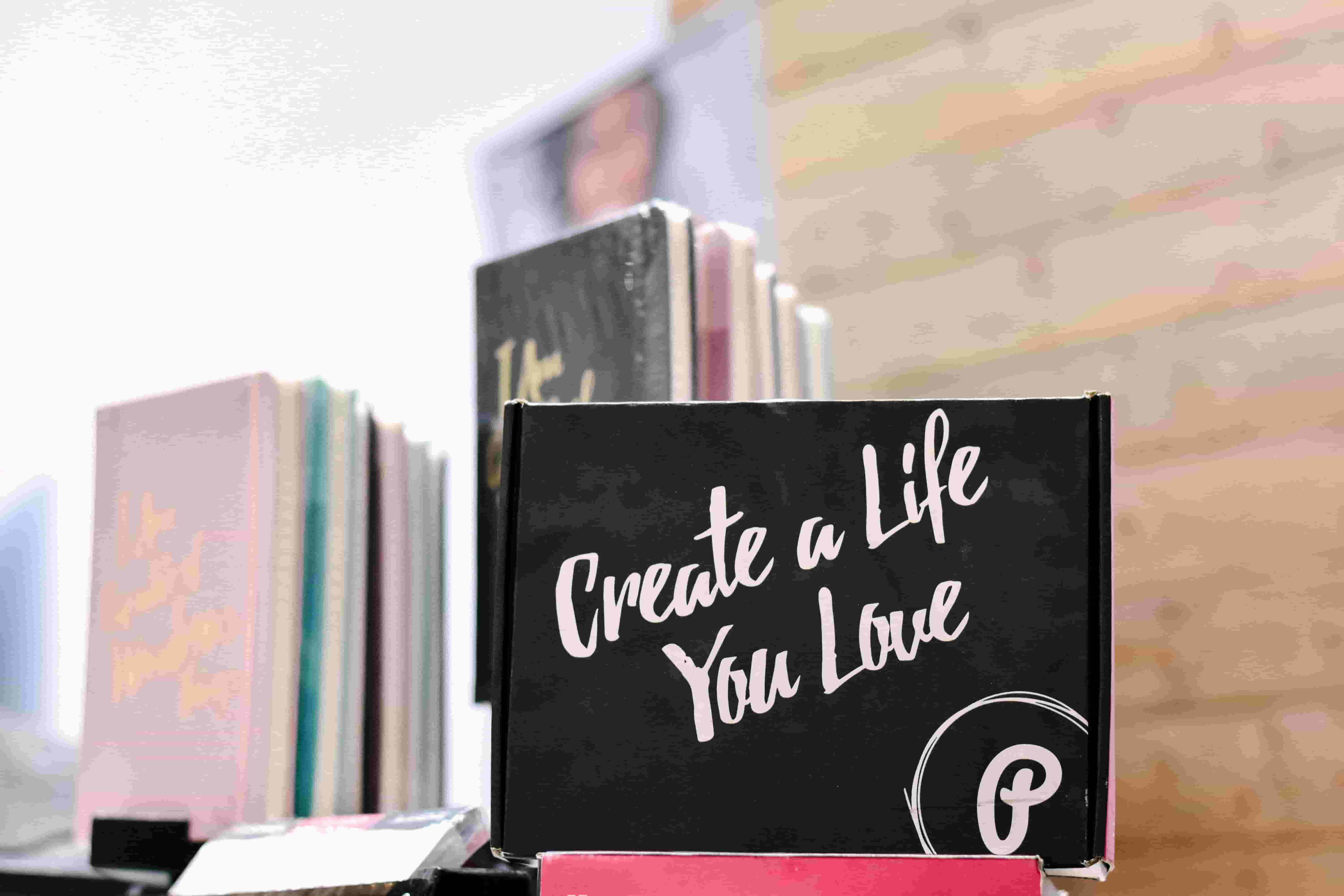 A box is displayed with an inspirational message, saying: Create a life you love