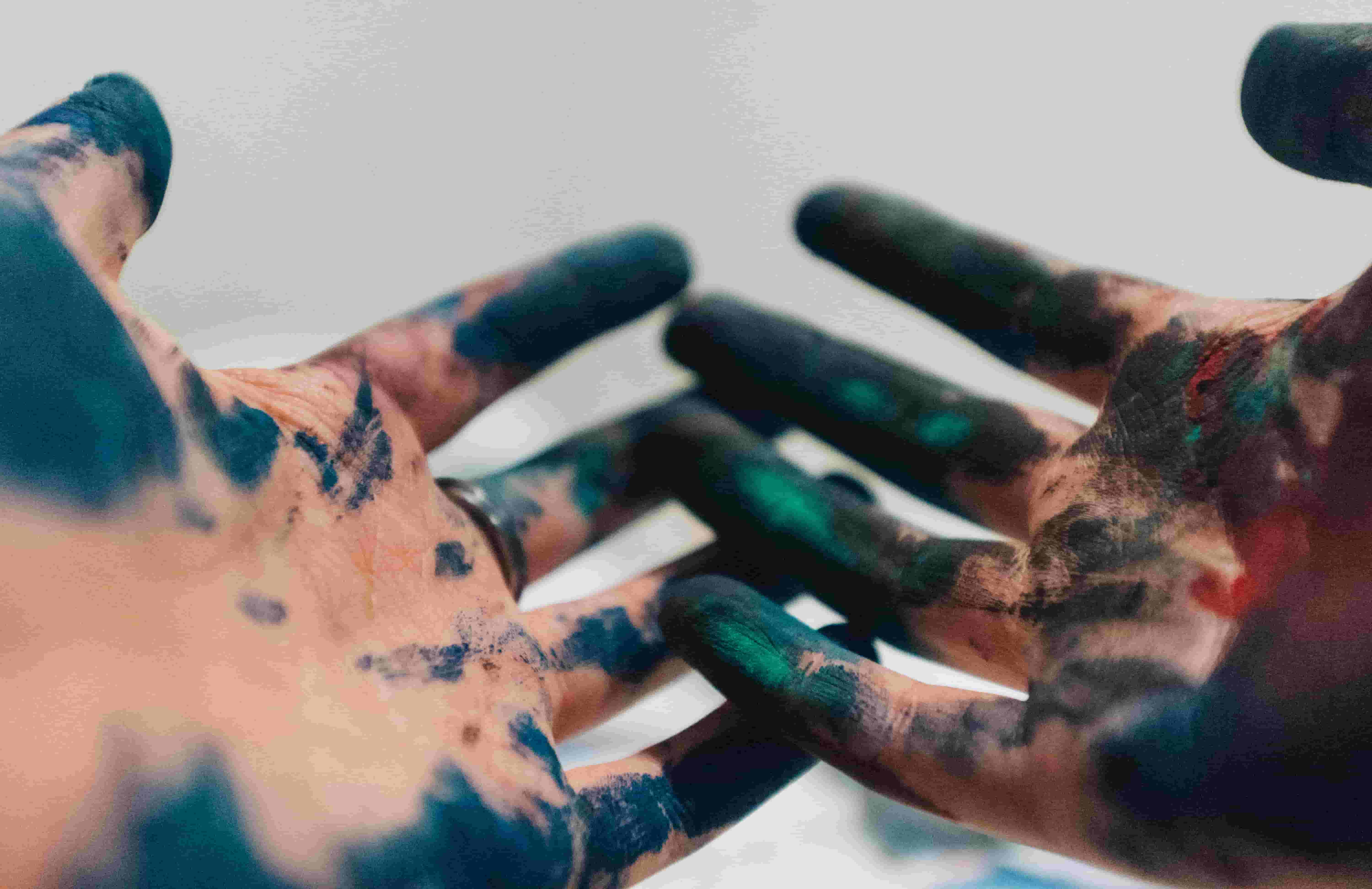 Close-up of paint covered hands