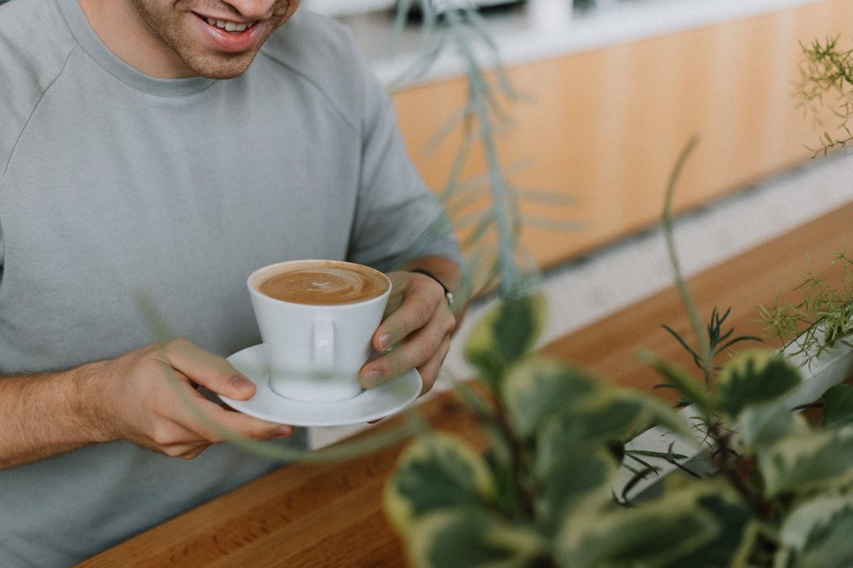 Young man drinking a cup of coffee