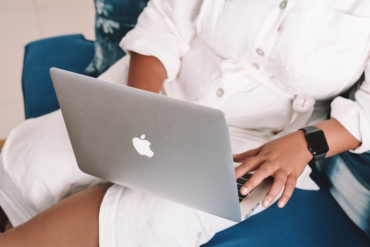 Image of a woman working on a laptop