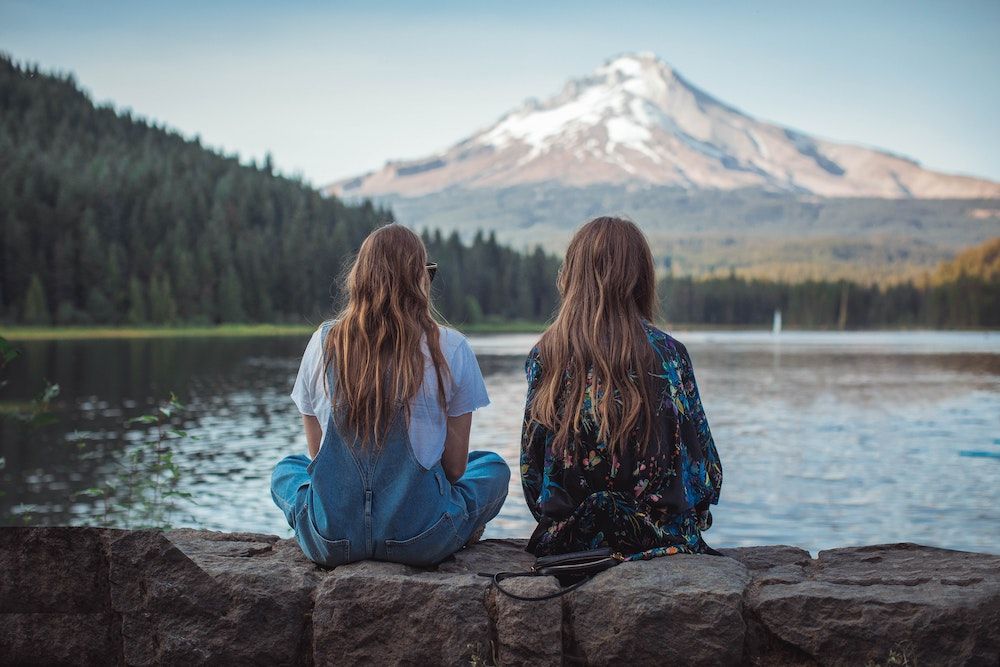 two friends looking at a natural view