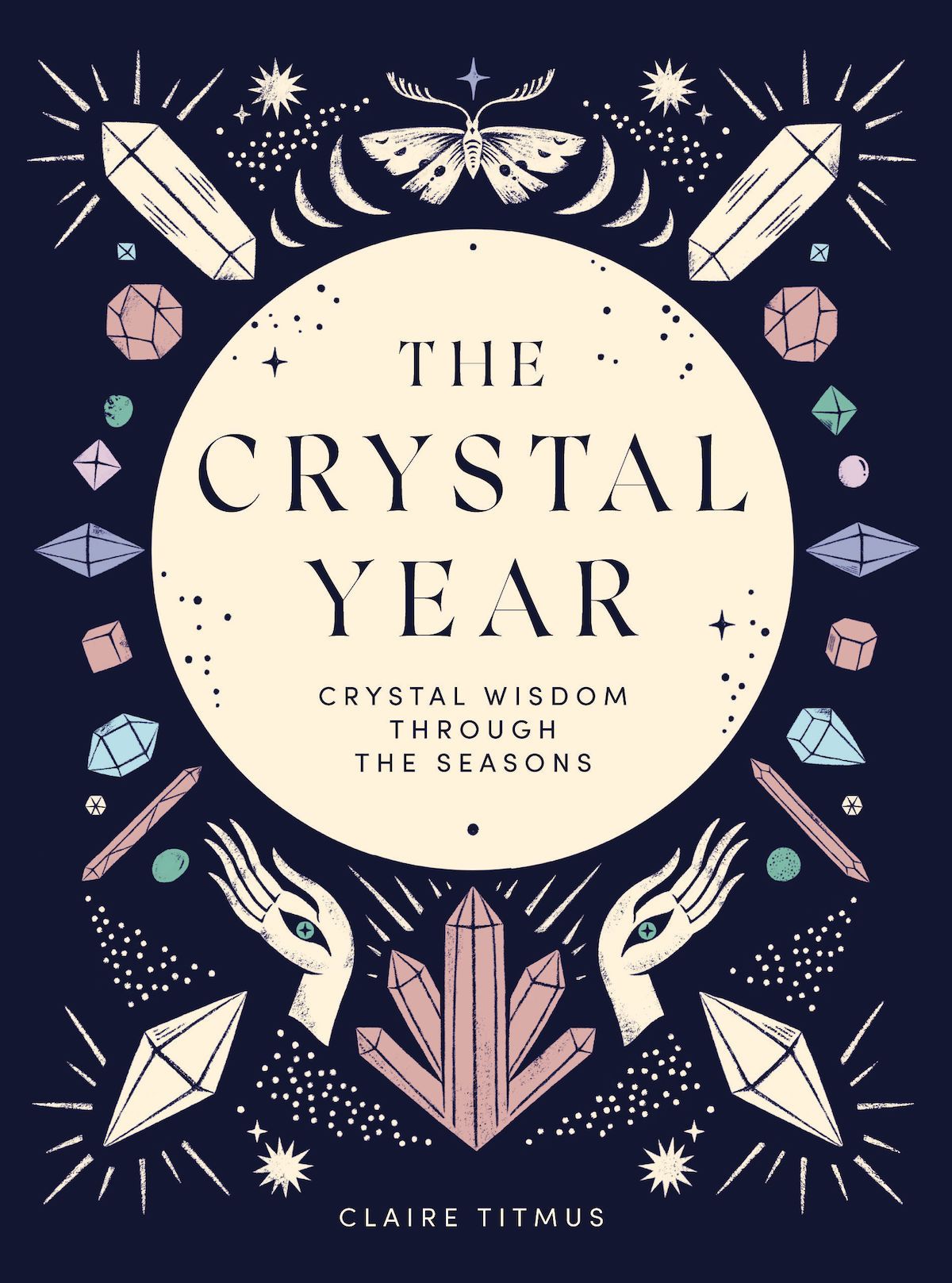 Book cover: Crystal year - Crystal wisdom through the seasons by Claire Titmus. A glowing moon is surrounded by crystal illustrations, hands and stars.